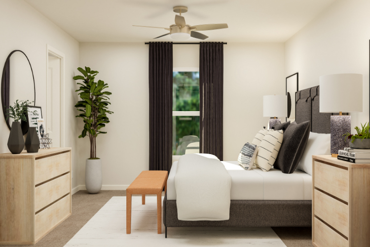 A living room with a white couch and a white chair.