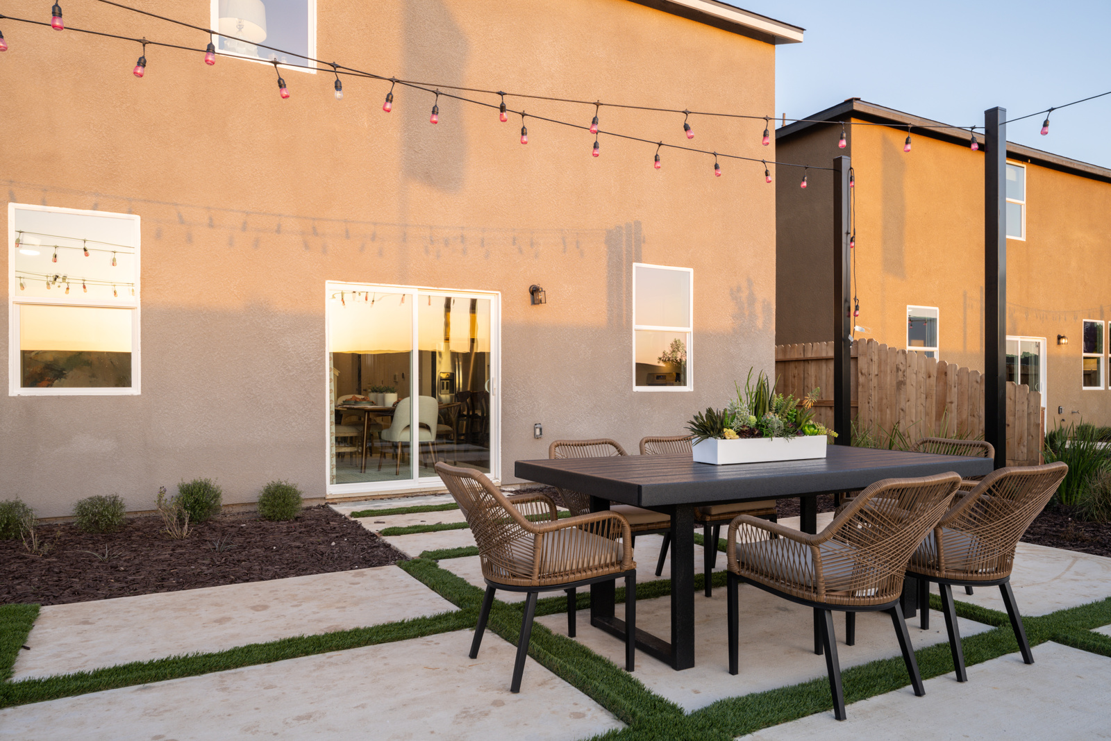 A table and chairs outside a building.