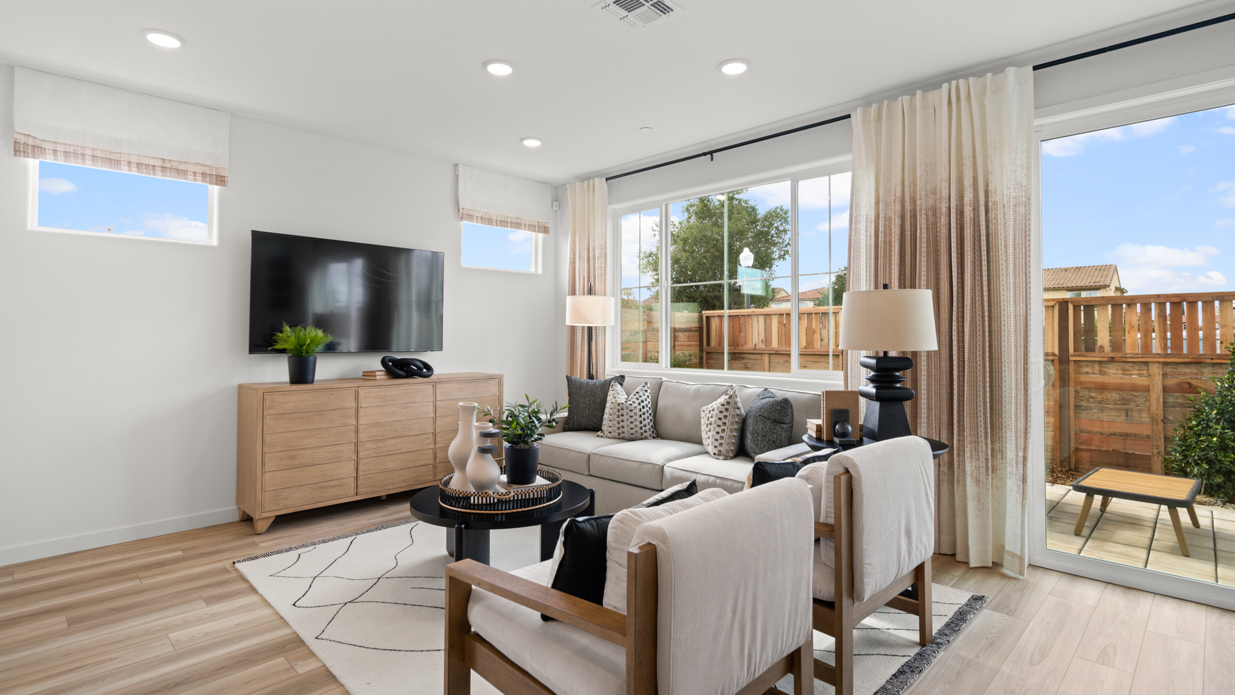 A living room with a large window.