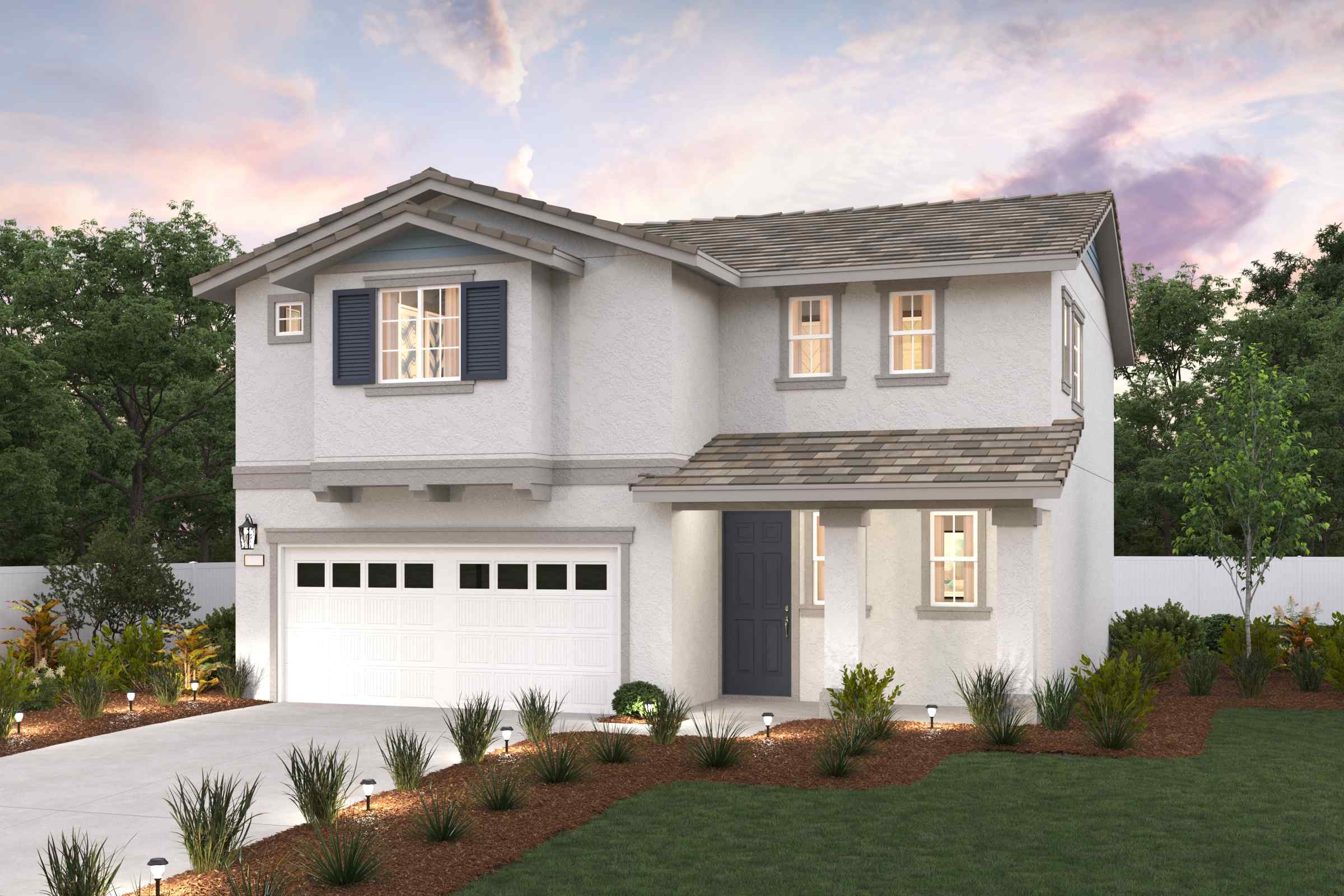 A white house with a garage.