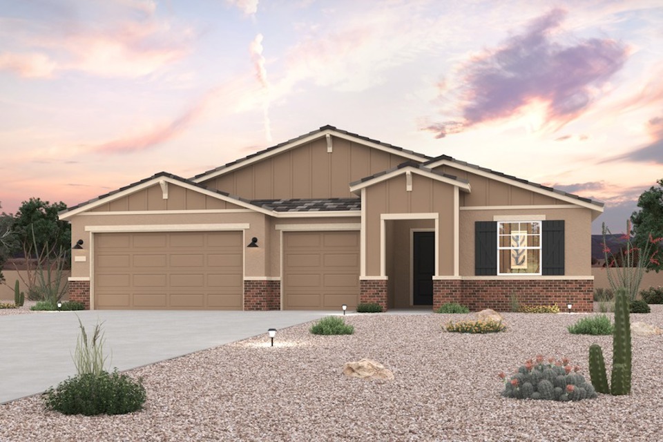 A house with a gravel driveway.