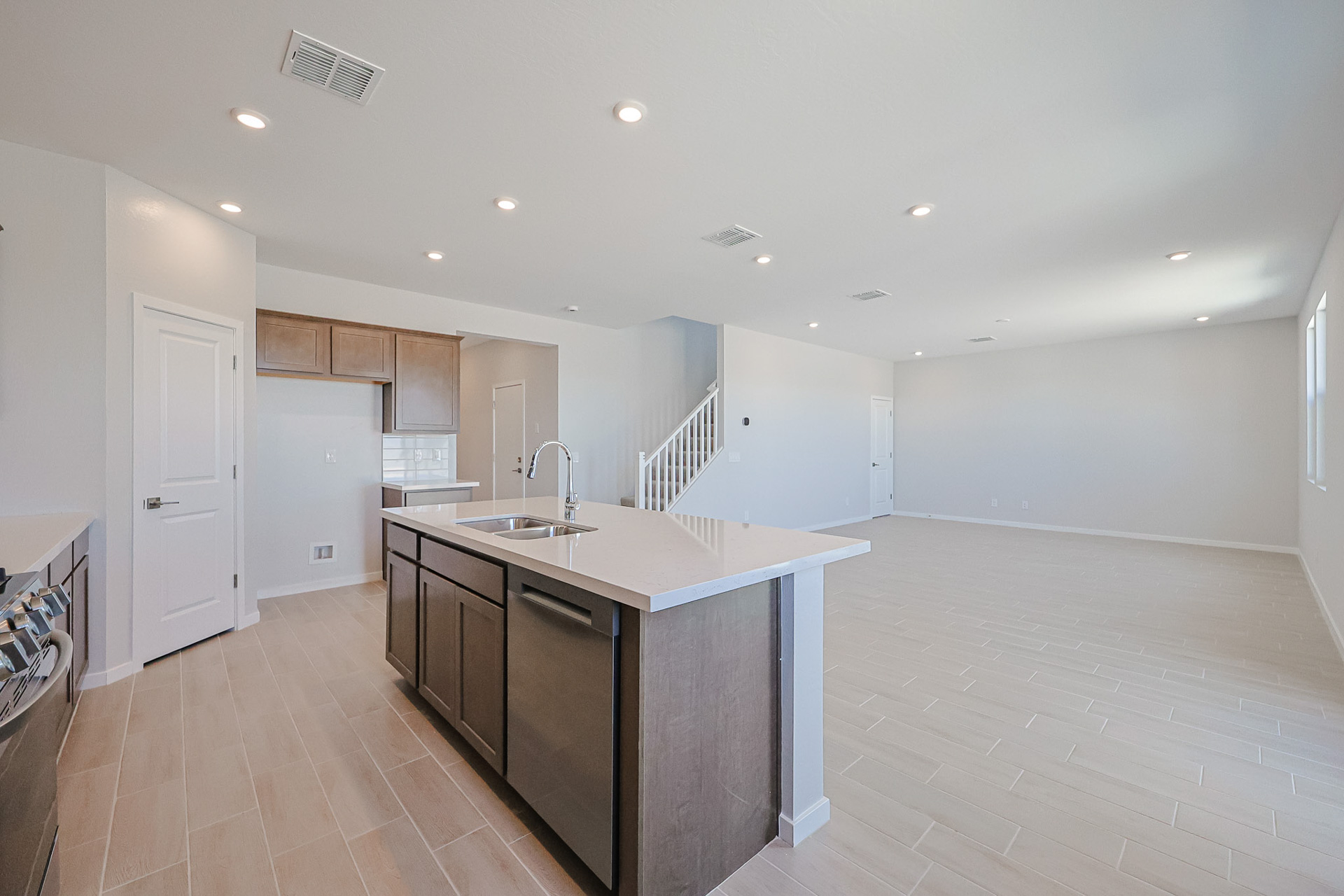 A kitchen with a marble island.