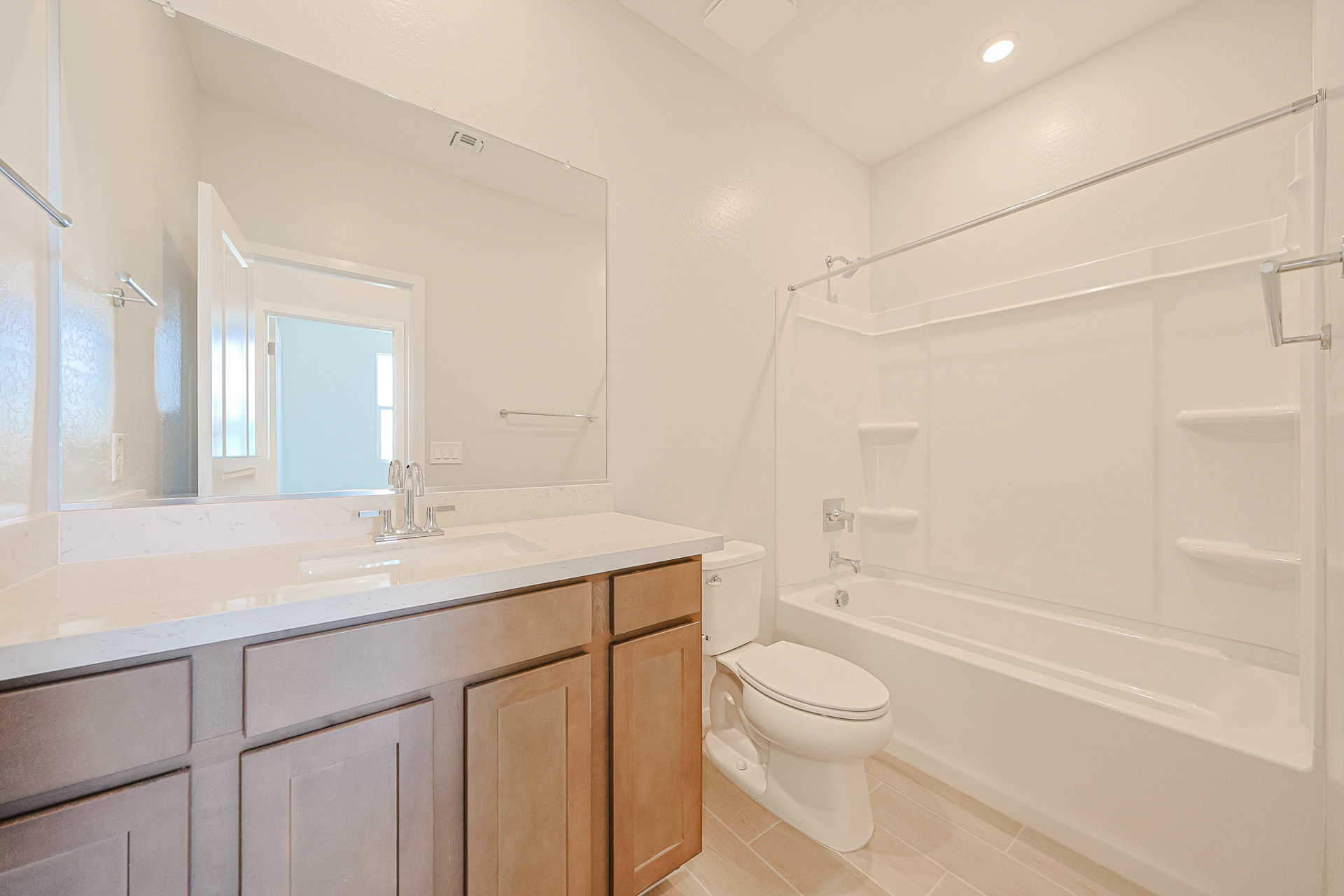 A bathroom with a tub toilet and sink.
