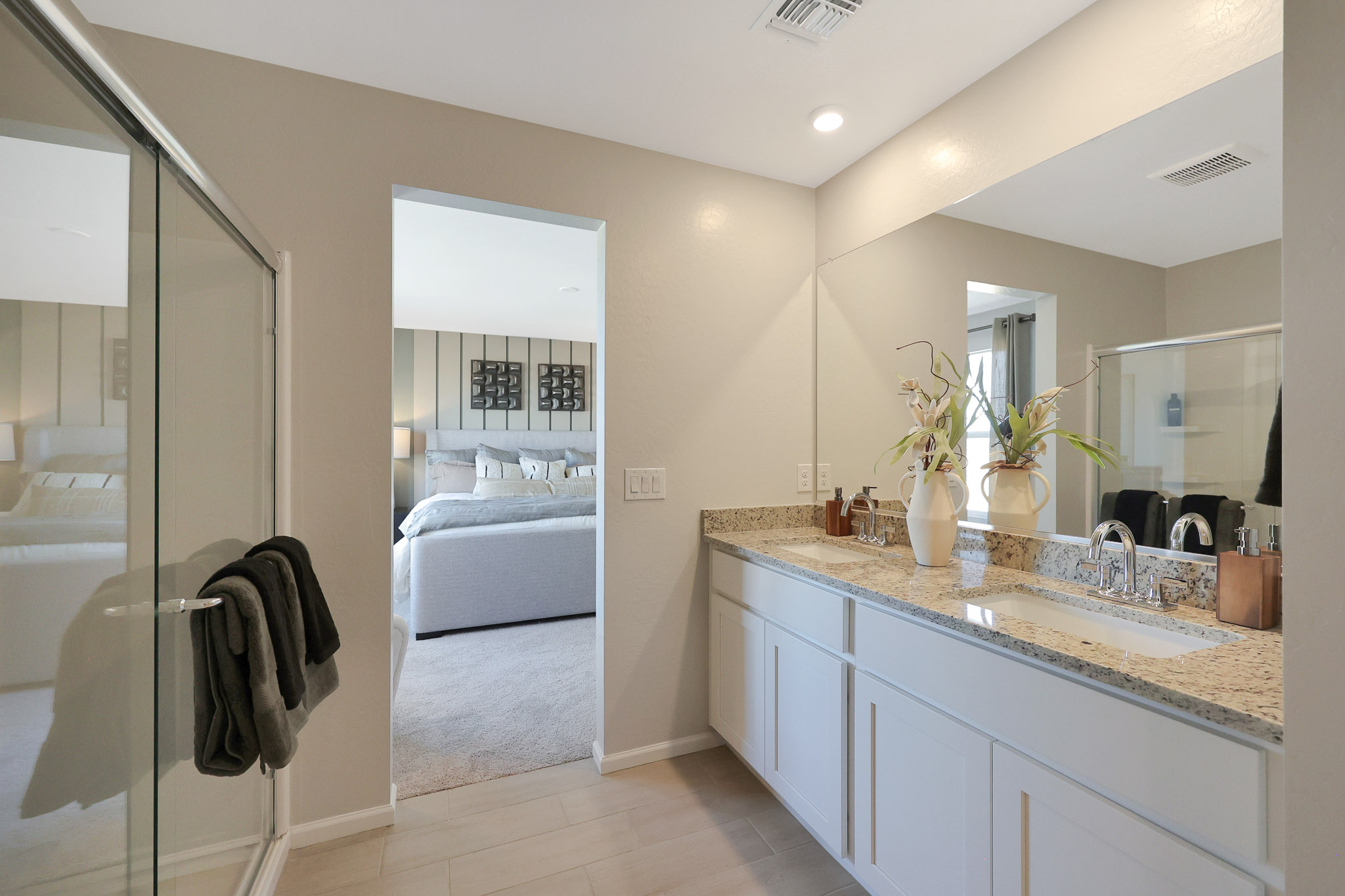 A bathroom with a tub sink and a shower.