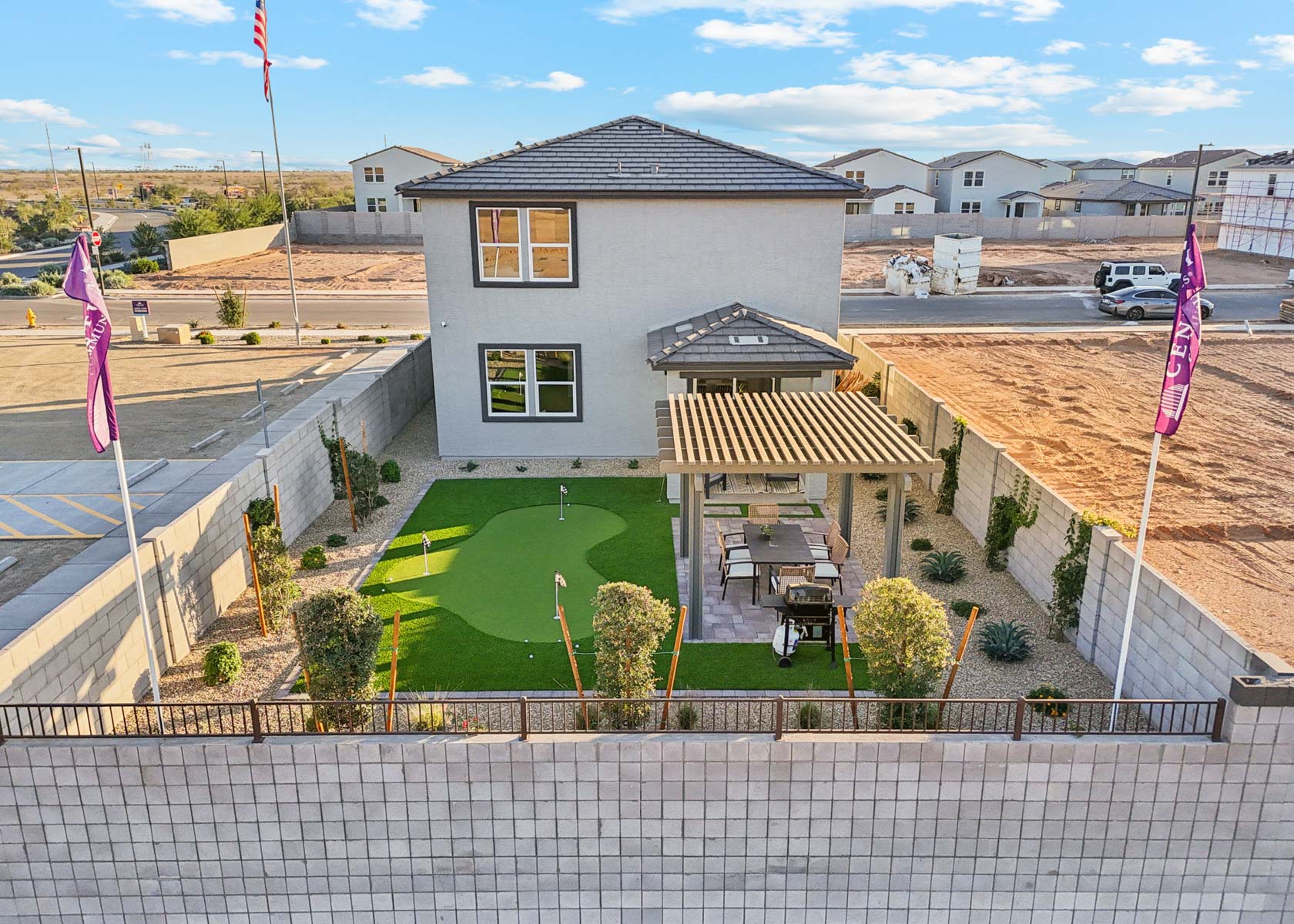 A house with a pool and a lawn.