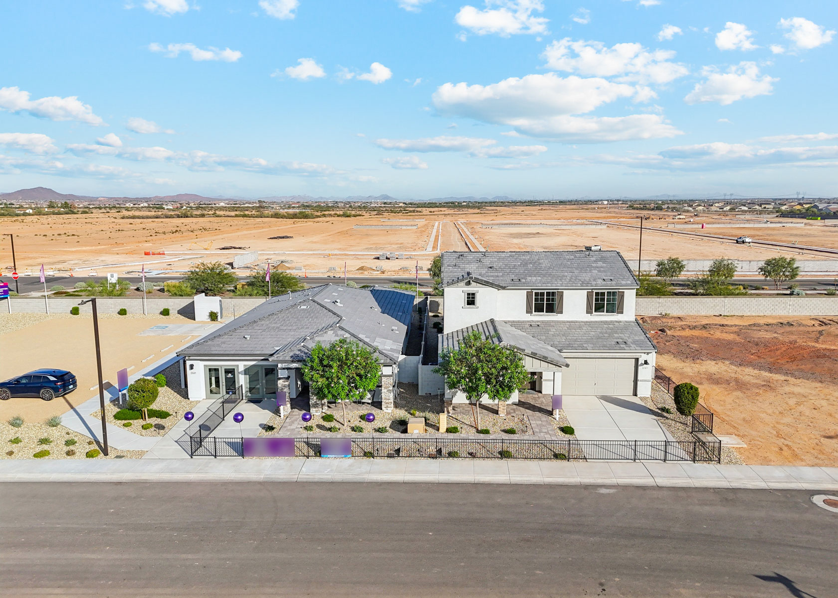 A group of houses in a desert.