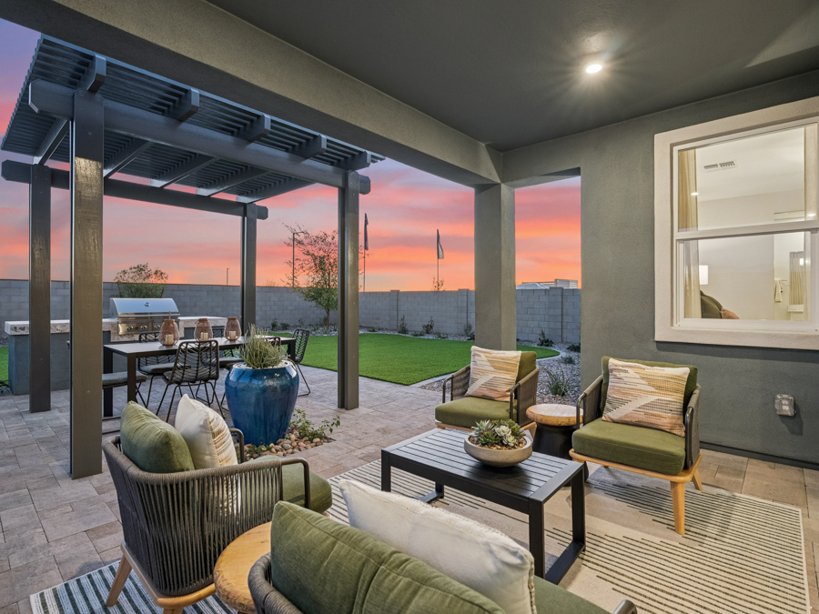 A patio with a table and chairs.
