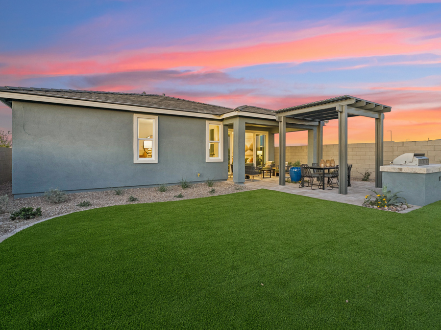 A house with a grass yard.