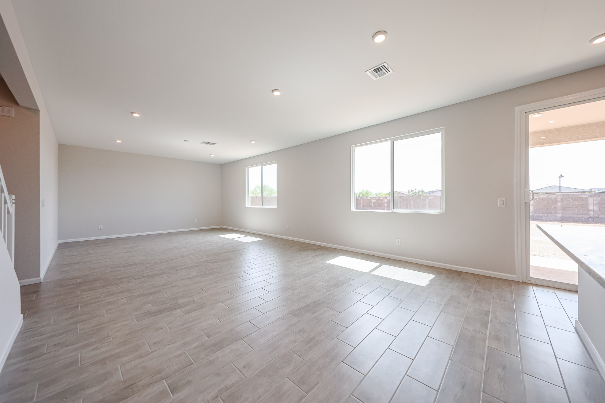 A large empty room with windows.