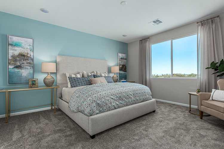 A bedroom with a large bed.