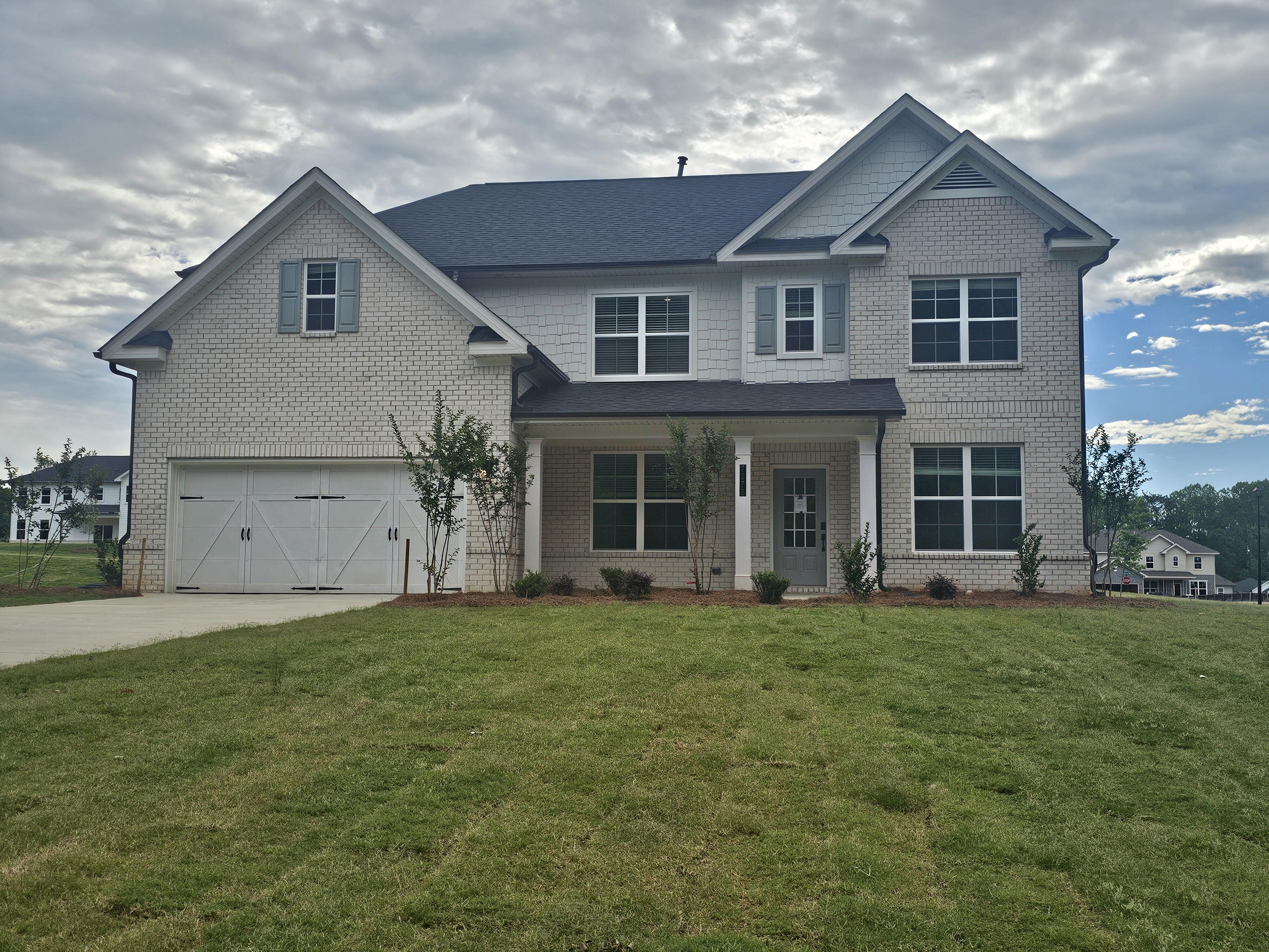 A large house with a garage.