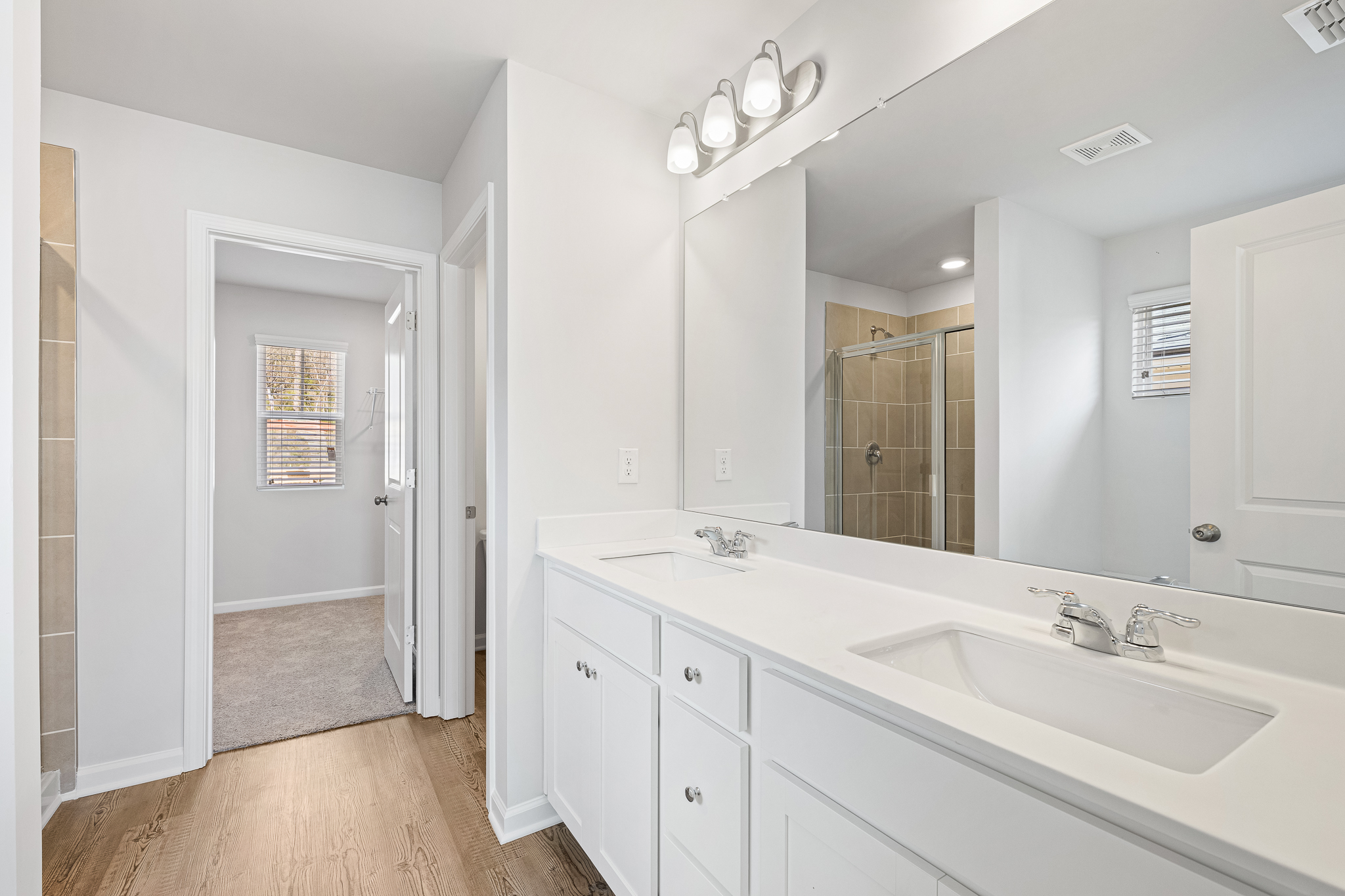 A bathroom with a large mirror.
