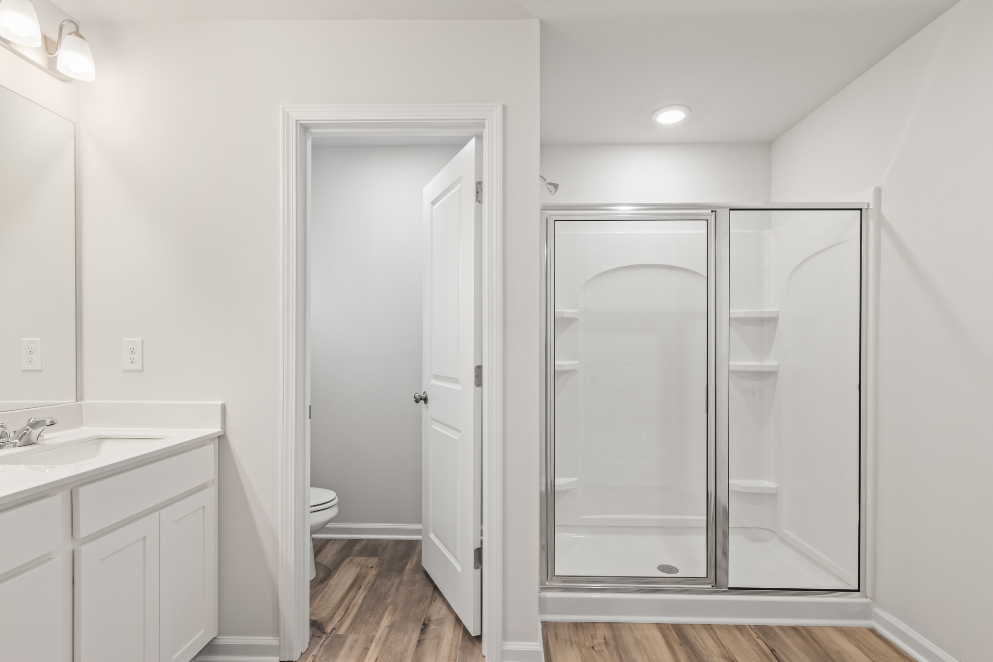 A bathroom with a glass shower.