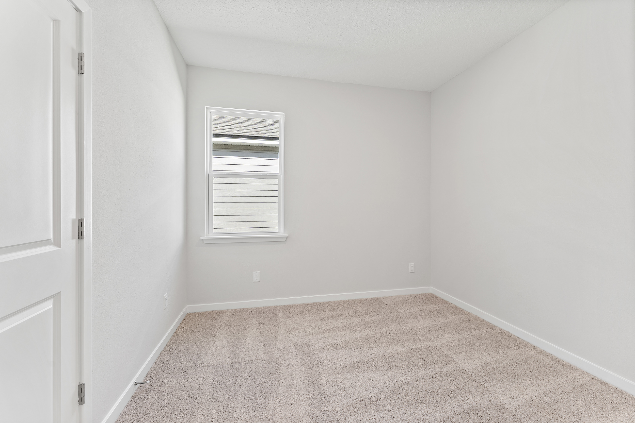 Lot 19 Cedar II Guest Room with Window and Closet at Camden Woods in Kingsland, GA