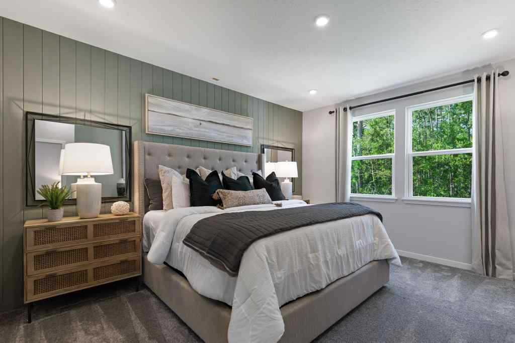 A bedroom with a bed and a mirror.