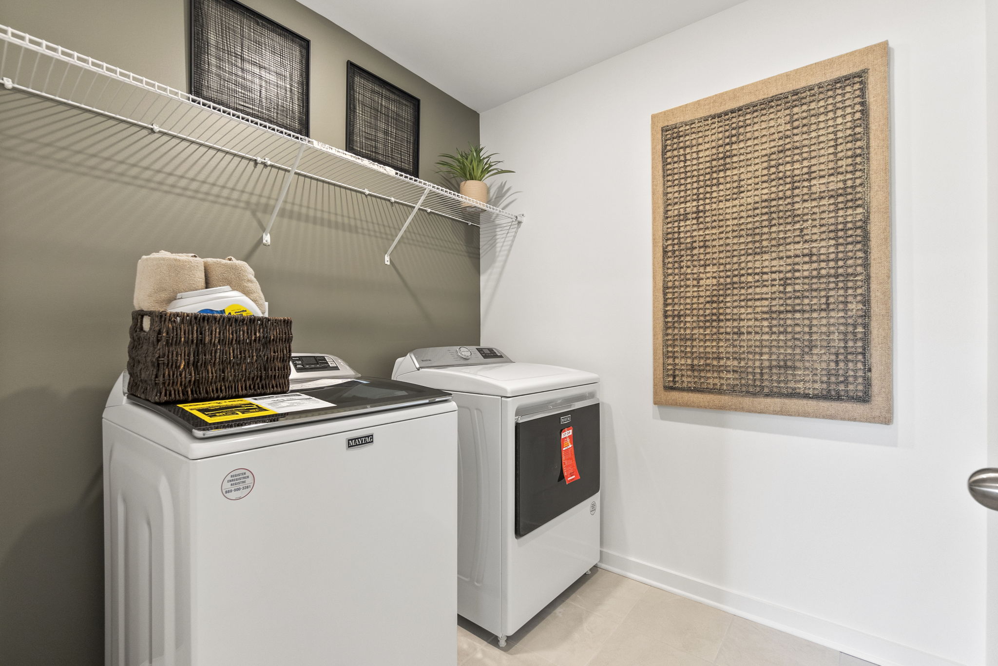 A laundry room with a washer and dryer.