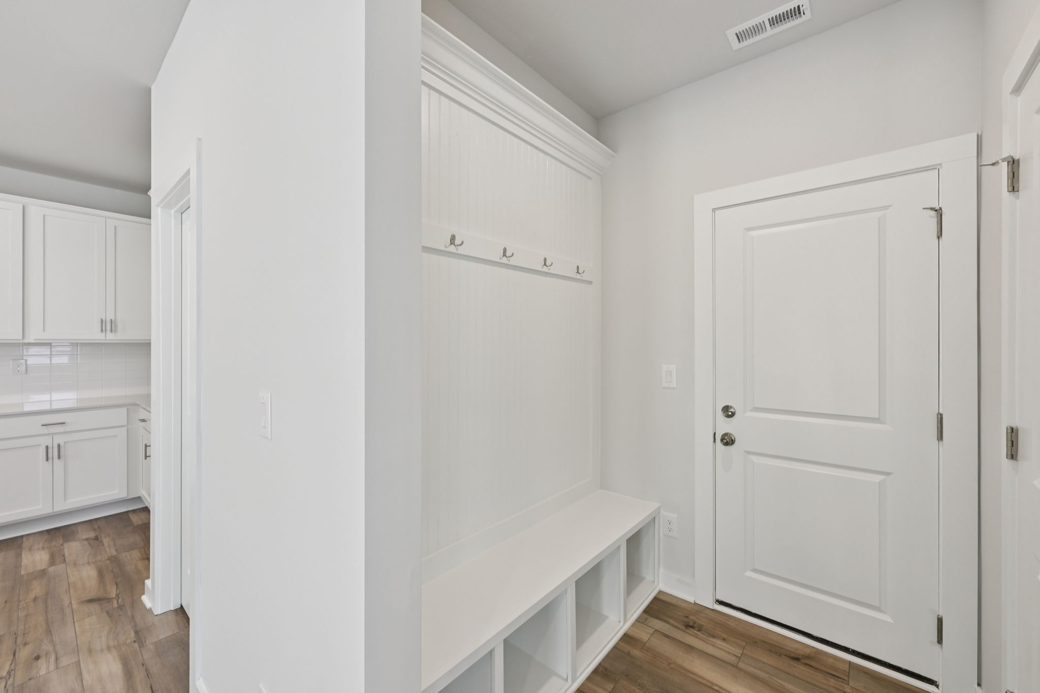 A room with white cabinets.