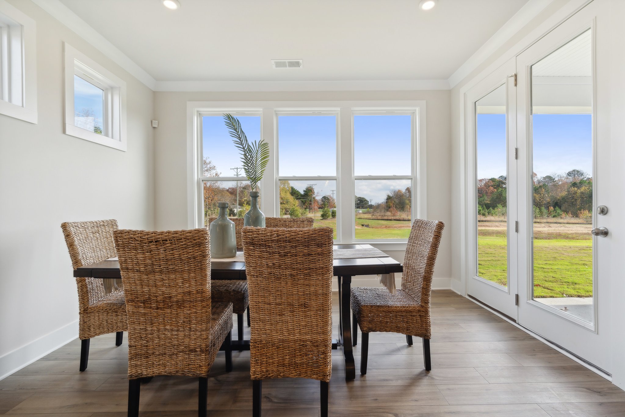 A dining room with a large window.