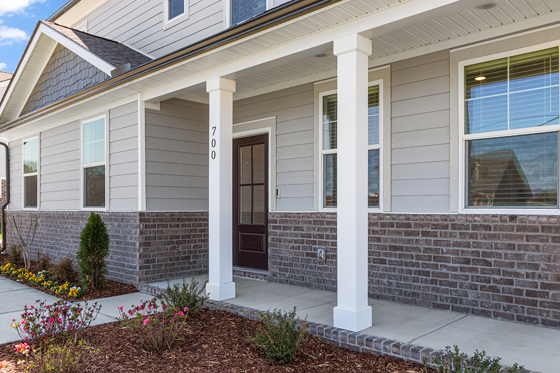 A house with pillars and a door.