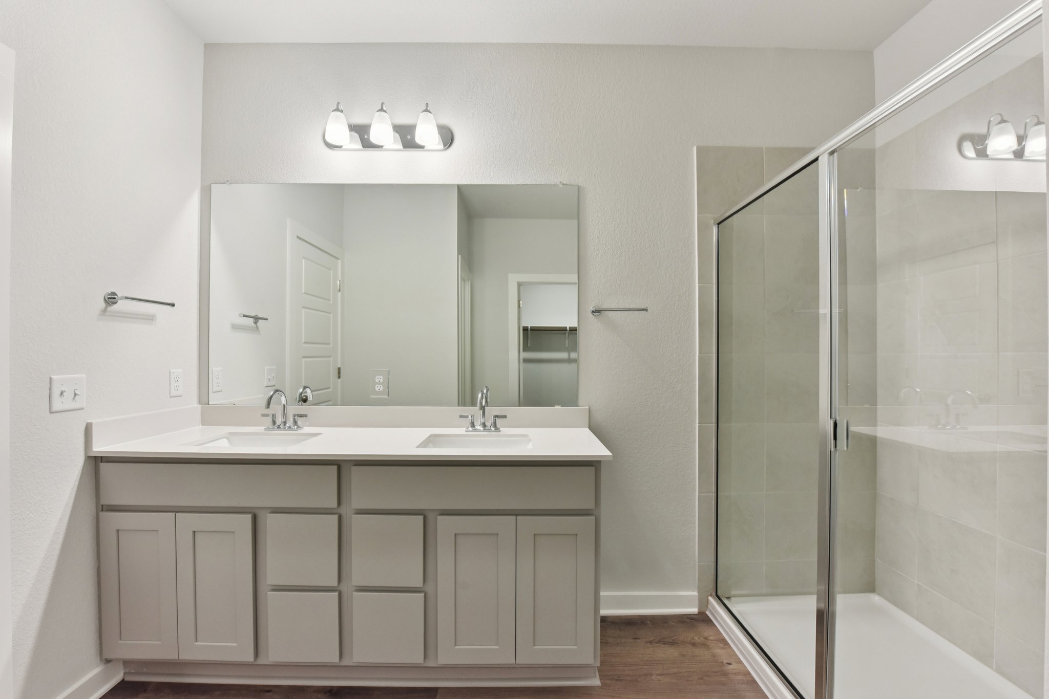 A bathroom with a glass shower.