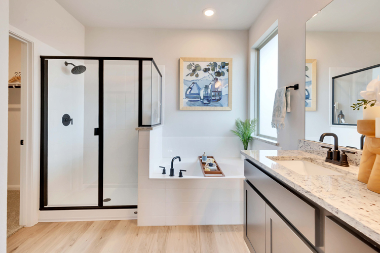 A bathroom with a sink and a mirror.