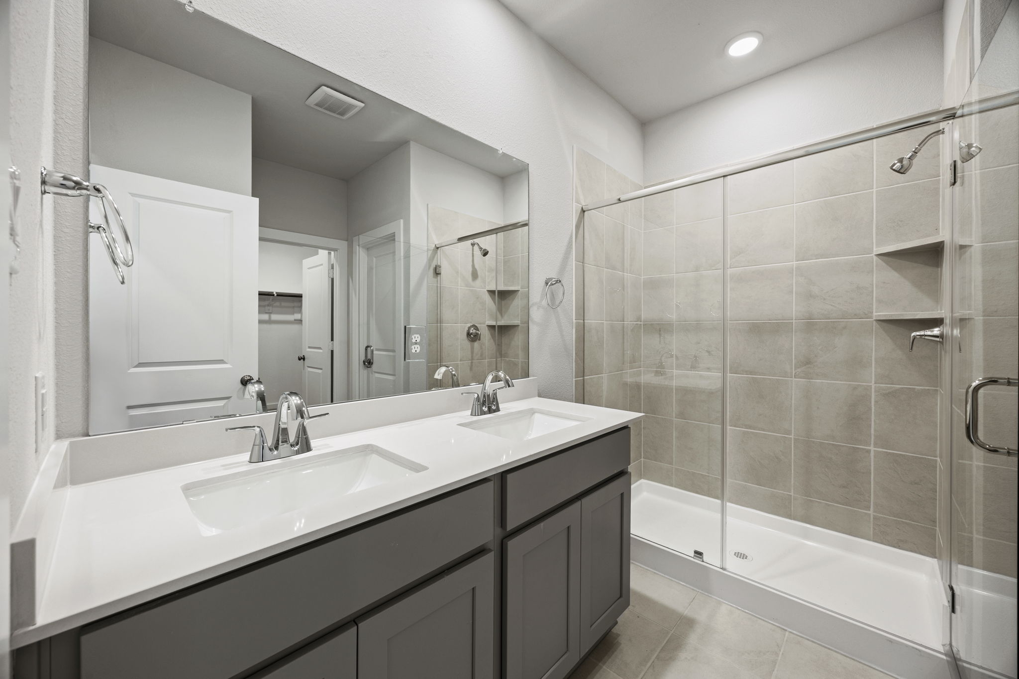 A bathroom with a glass shower.