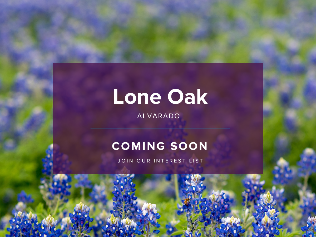 A sign in a field of flowers.