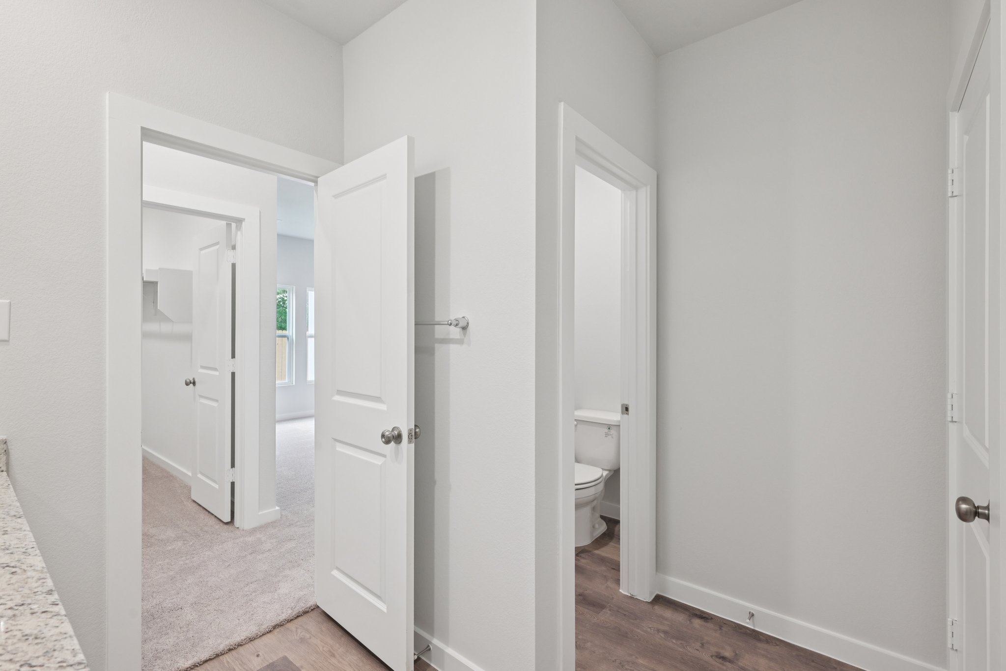 A bathroom with white doors.