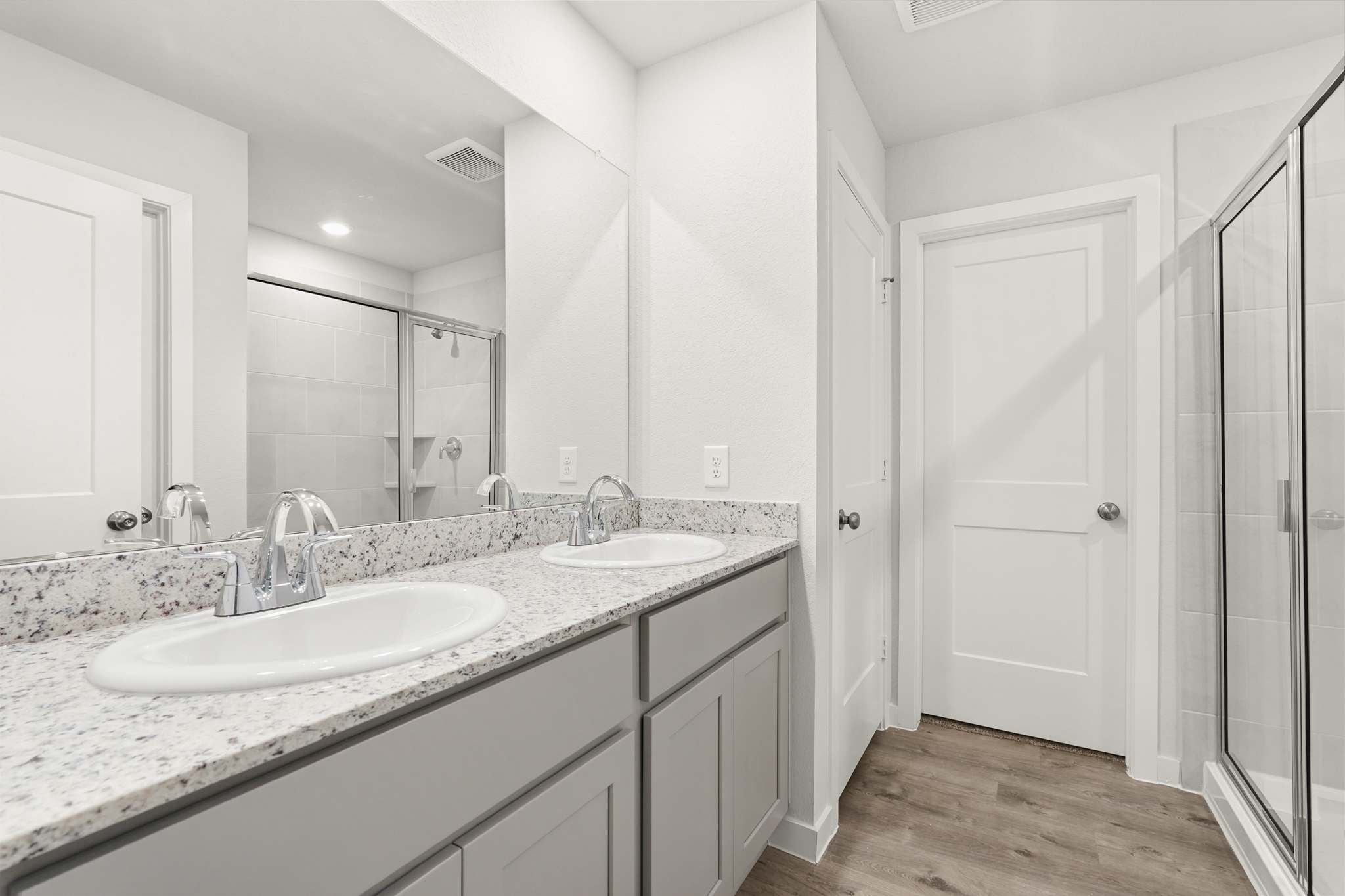 A bathroom with a marble countertop.