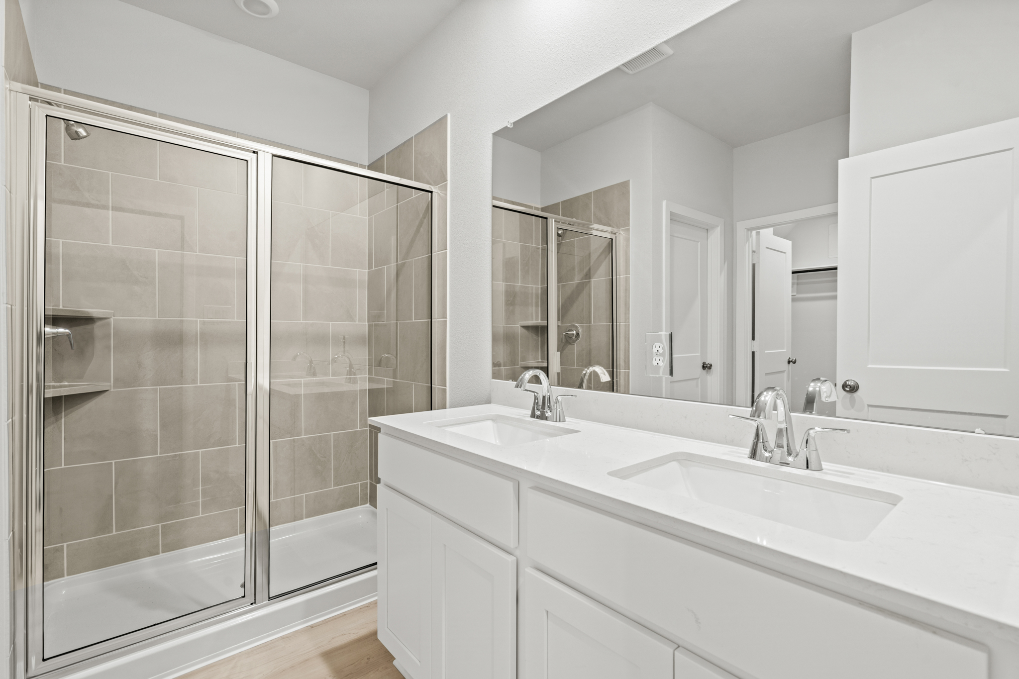 A bathroom with a glass shower.