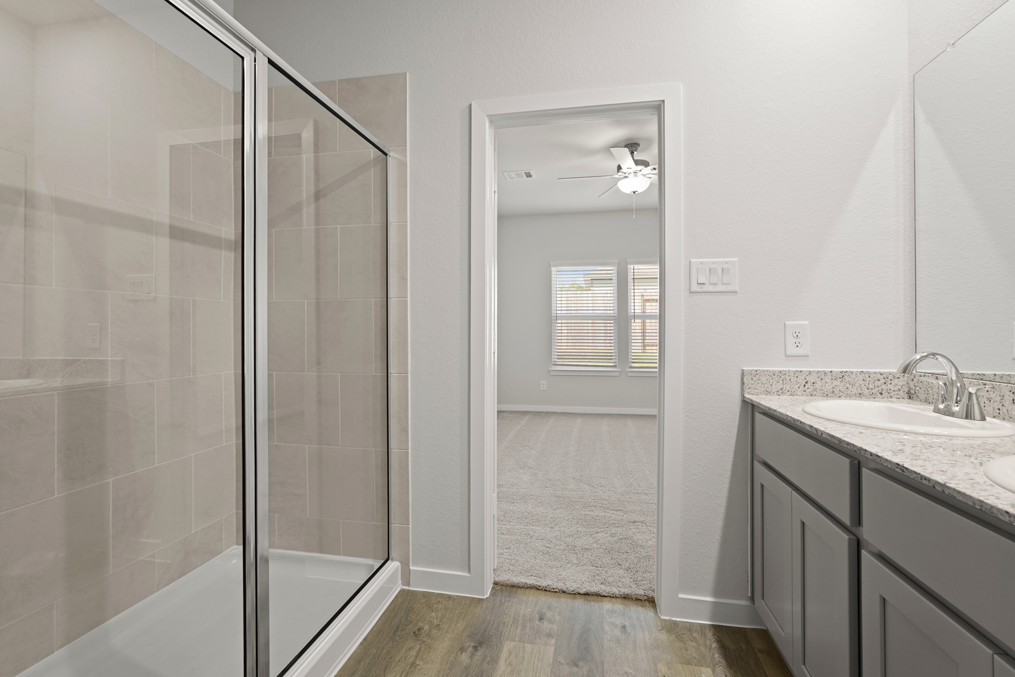 A bathroom with a glass shower.