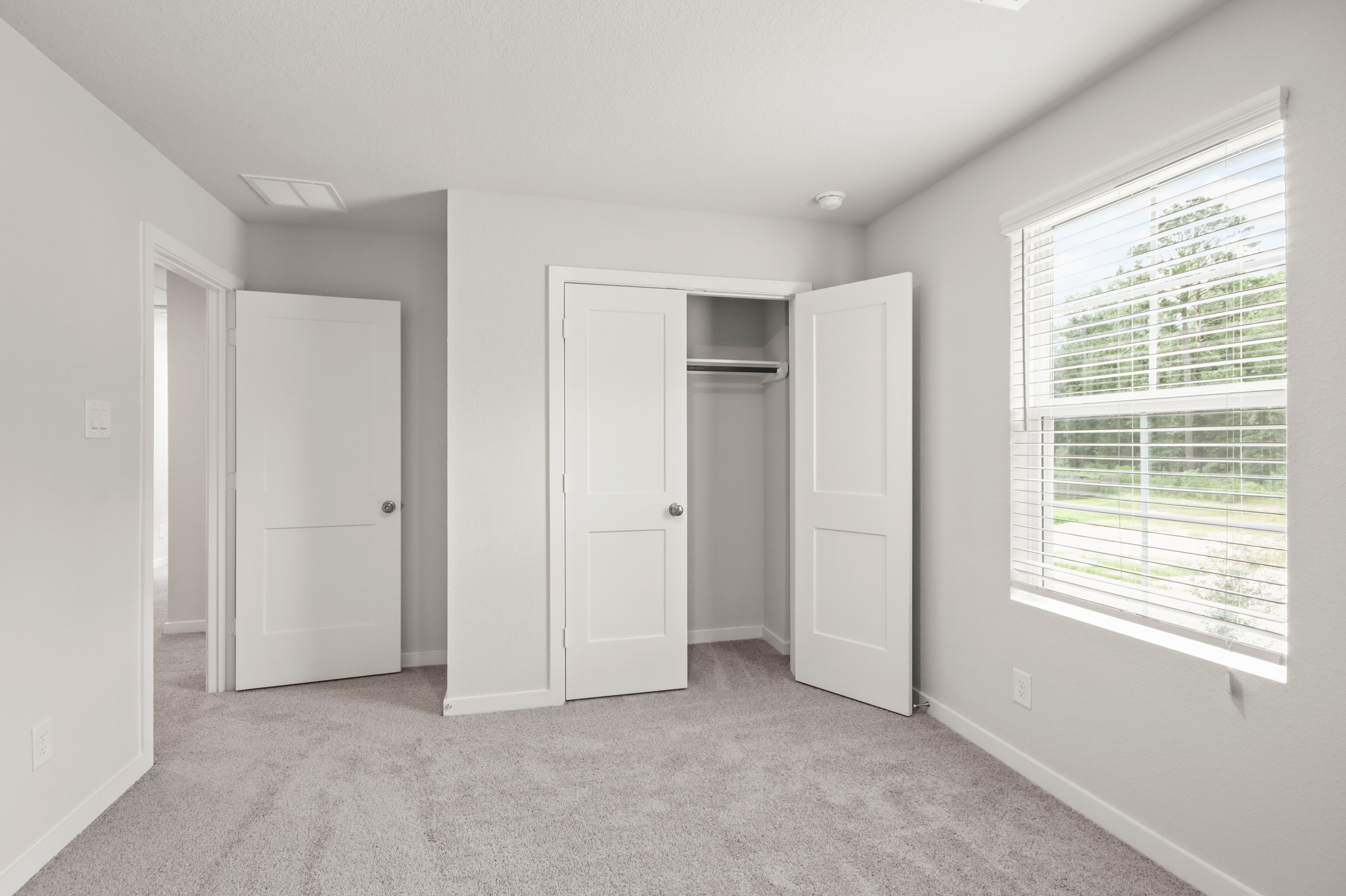 A room with white doors.