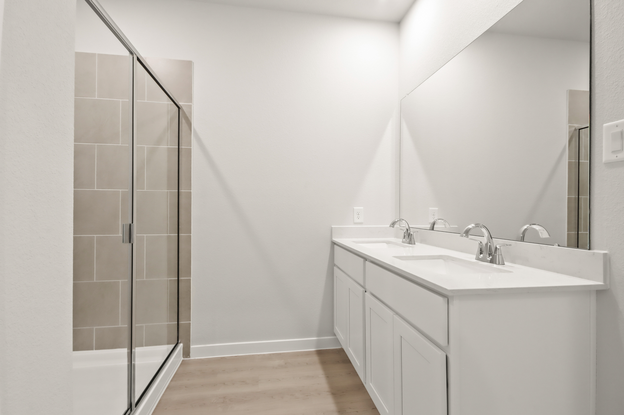 A bathroom with a glass shower.