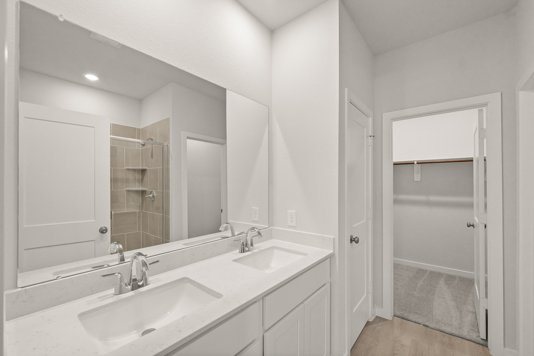 A bathroom with a glass shower.