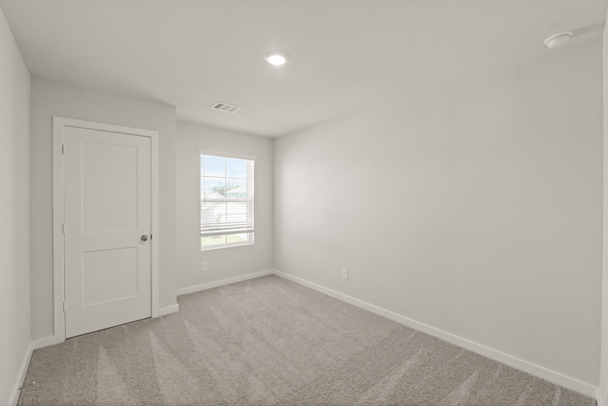 A room with a door and a window.