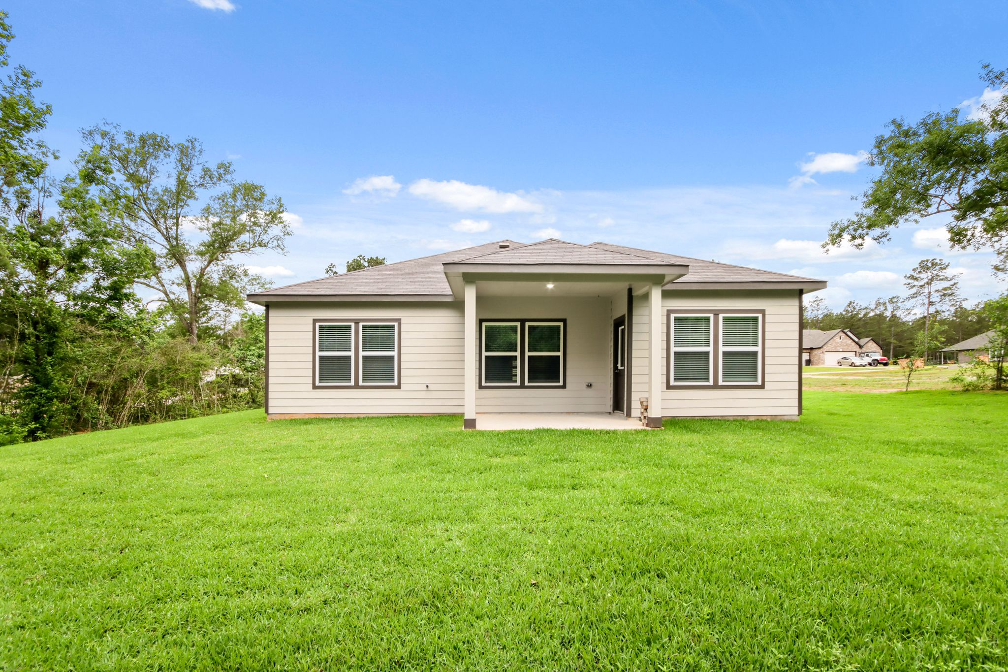 A house with a grass yard.