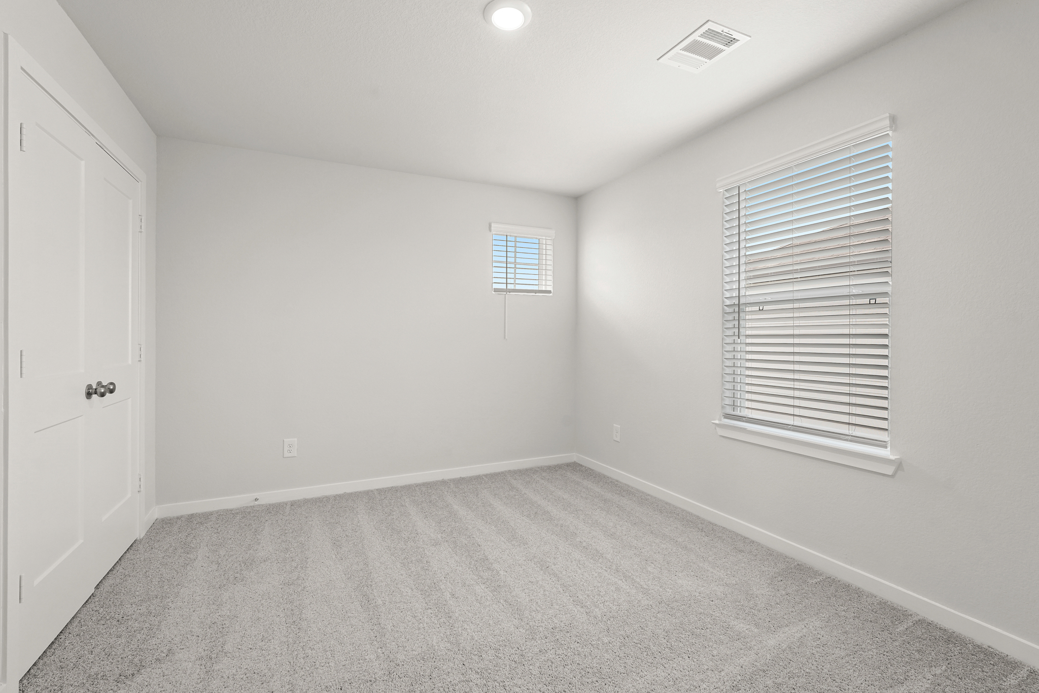 A room with a door and a window.