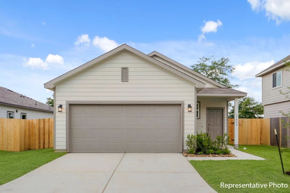 A house with a garage with American Gothic House in the background.