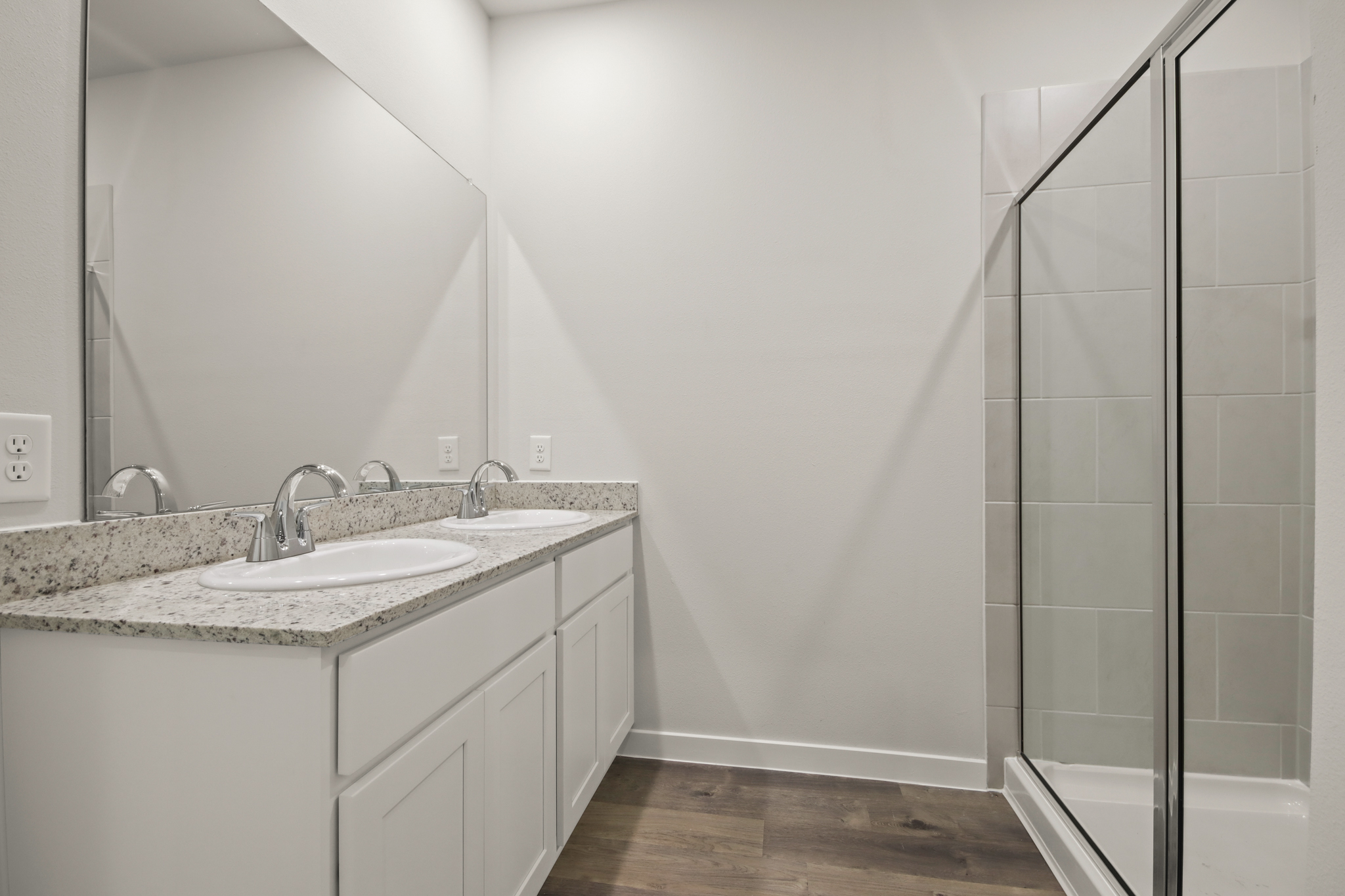 A bathroom with a glass shower.