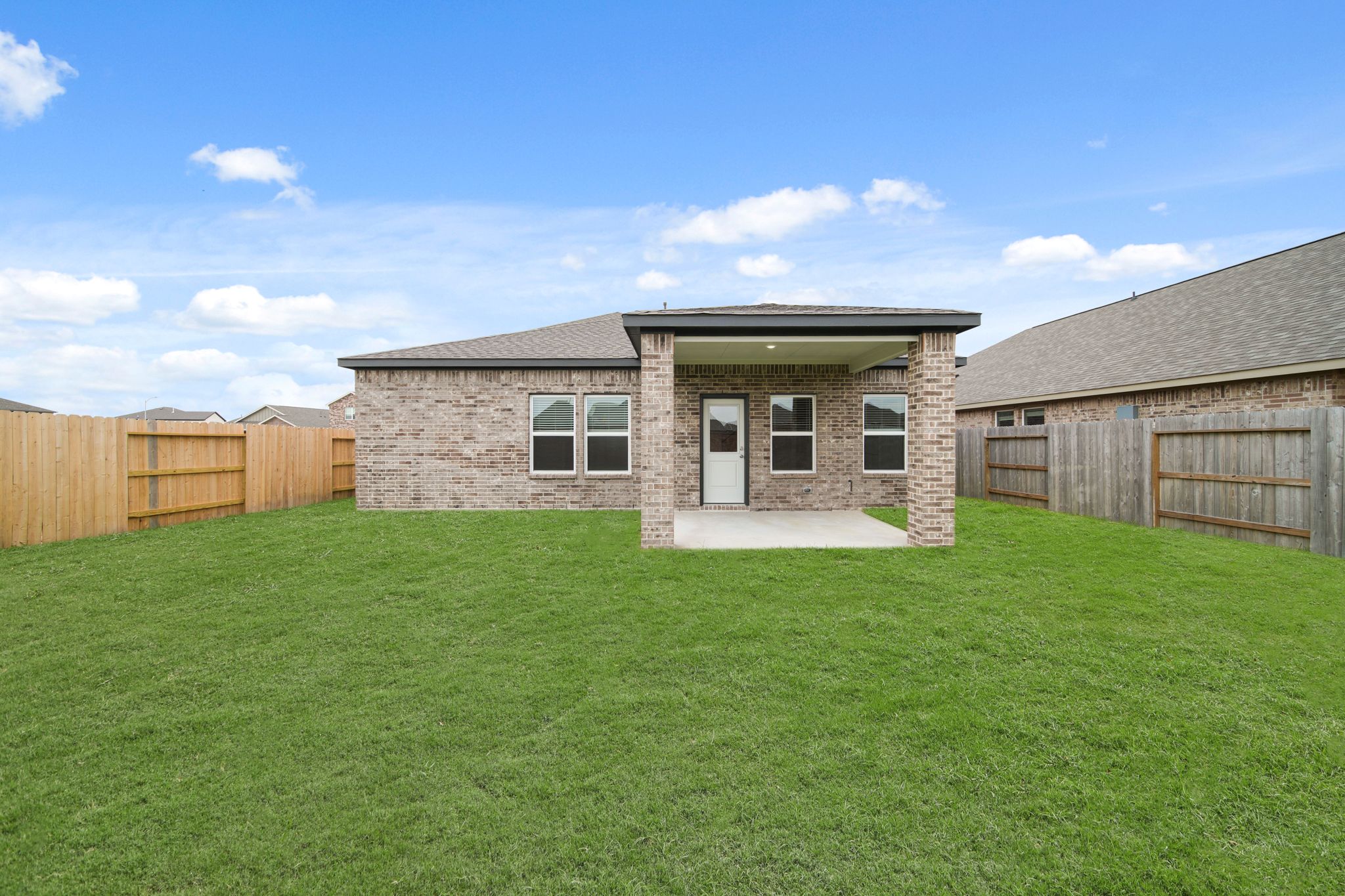 A house with a grass yard.