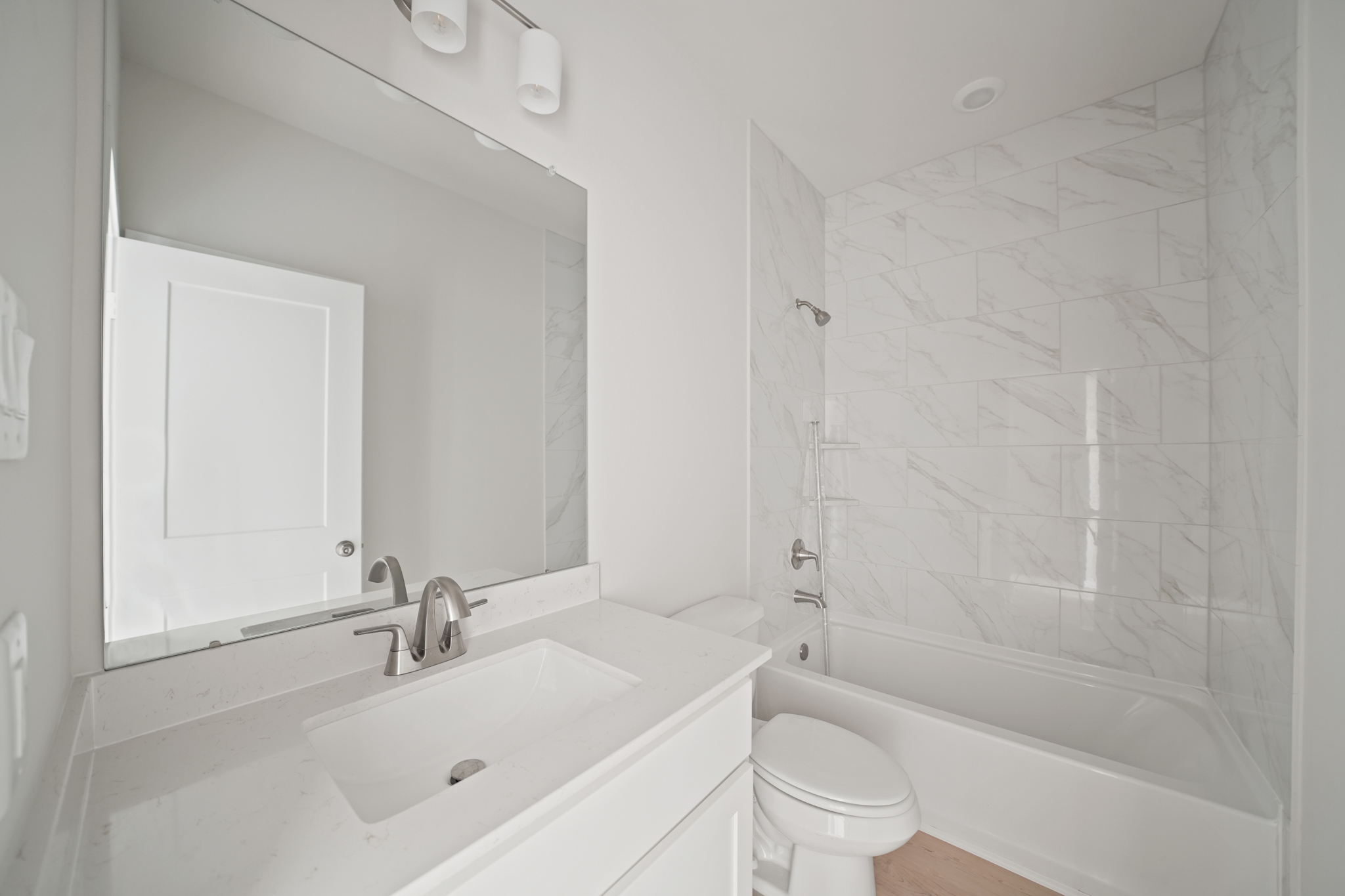 A bathroom with a sink and toilet.