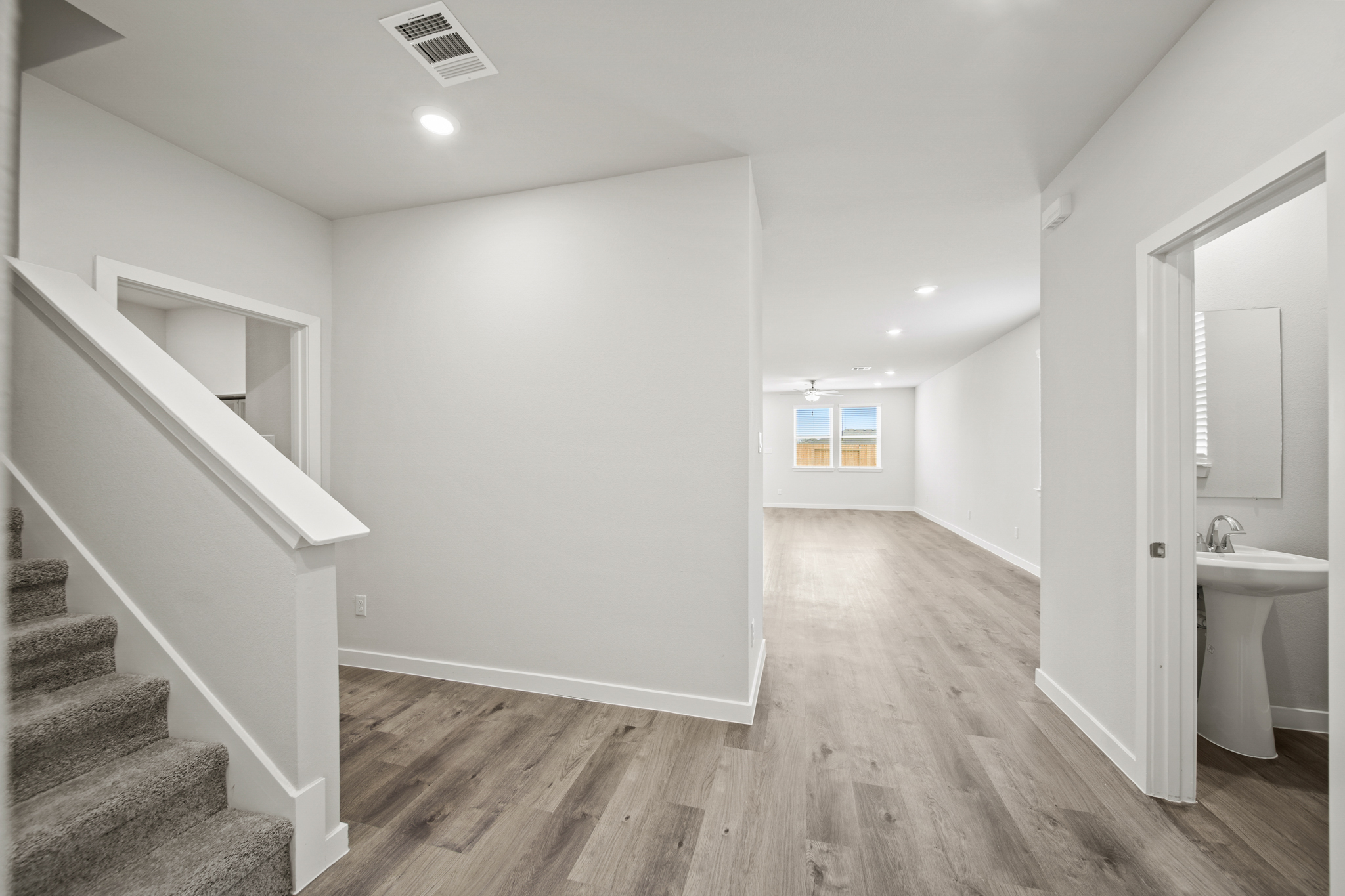 A bathroom with a wood floor.