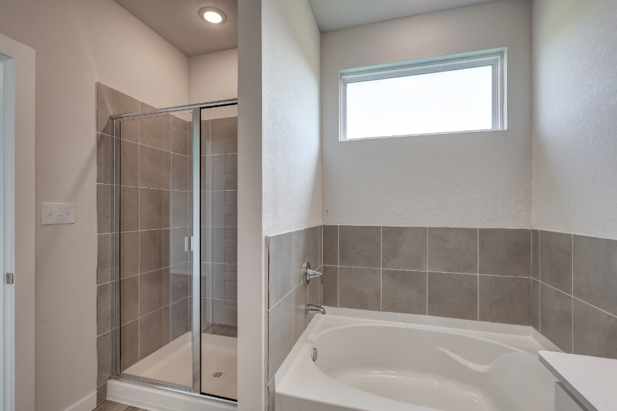 A bathroom with a glass shower.