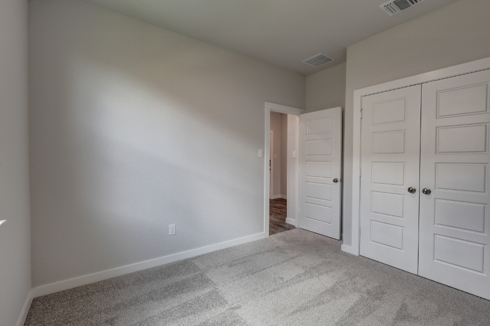A room with white cabinets.