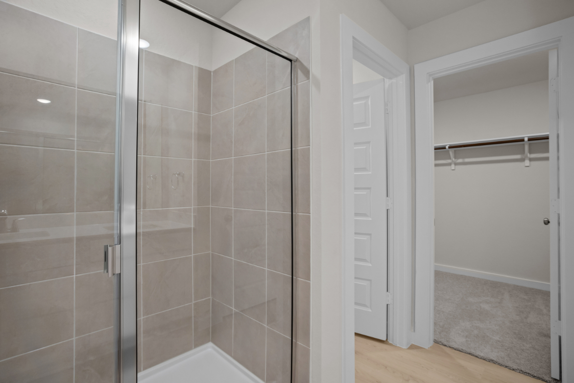 A shower with glass doors.