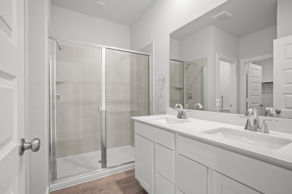 A bathroom with a glass shower.