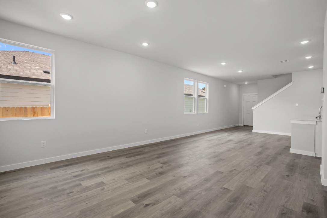 A room with a wood floor and a wood floor.