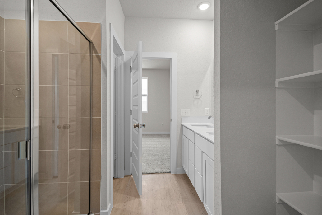 A bathroom with a glass shower.