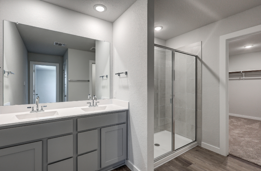 A bathroom with a glass shower.