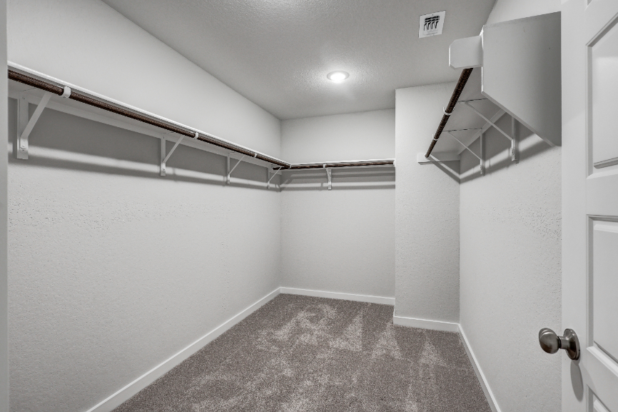 A hallway with white walls.